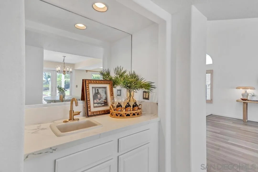 7967 Wing Span Drive San Diego, CA 92119 - Photo 18 of 45 a bathroom with a sink a vanity and a mirror