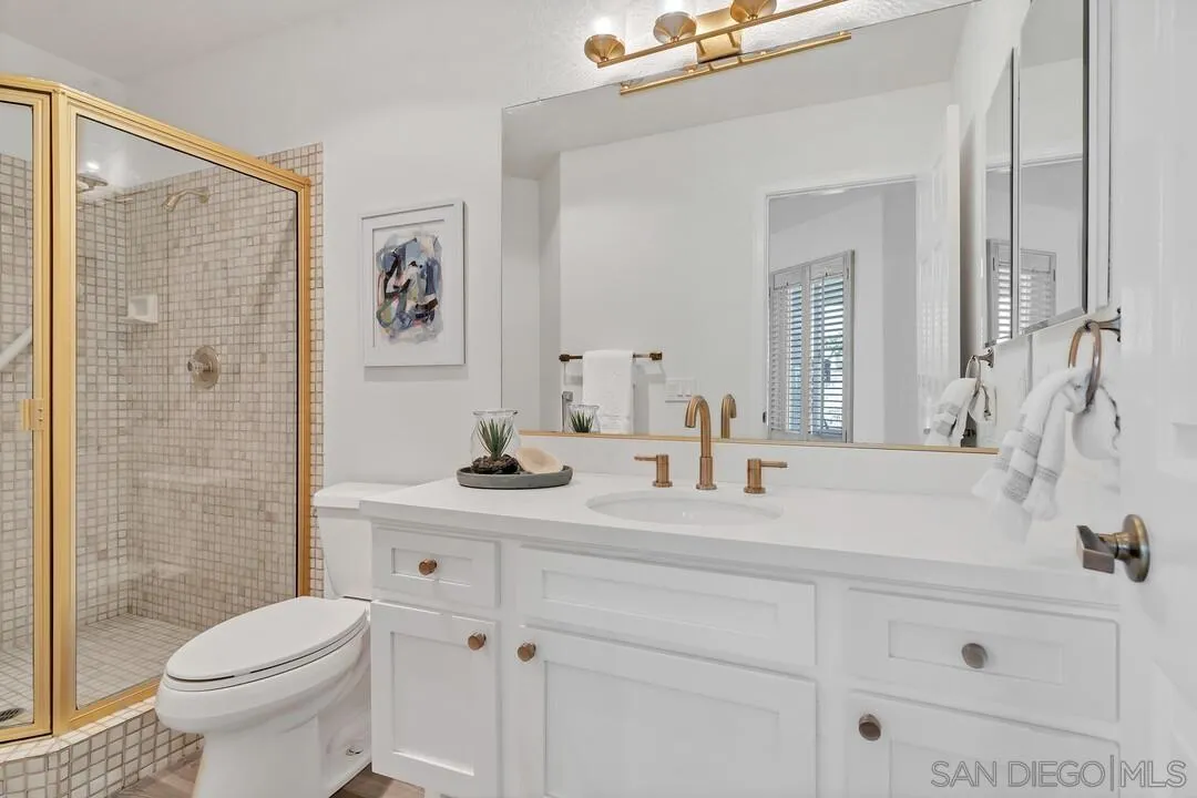 7967 Wing Span Drive San Diego, CA 92119 - Photo 21 of 45 a bathroom with a sink toilet and shower