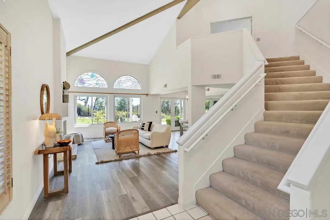 7967 Wing Span Drive San Diego, CA 92119 - Photo 22 of 45 a living room with furniture and a large window