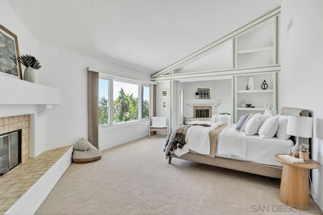 7967 Wing Span Drive San Diego, CA 92119 - Photo 24 of 45 a bed room with a bed and a fireplace