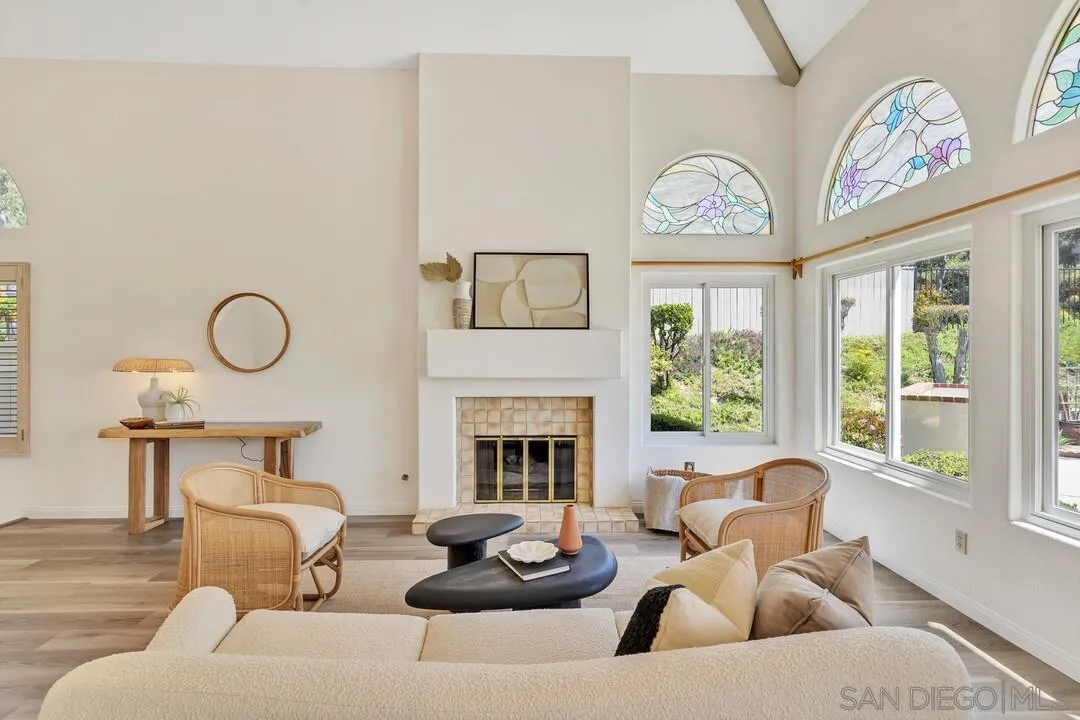 7967 Wing Span Drive San Diego, CA 92119 - Photo 3 of 45 a living room with furniture chandelier and a fireplace