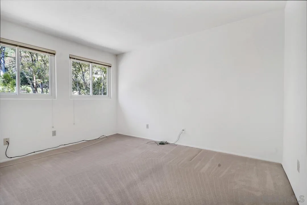 7967 Wing Span Drive San Diego, CA 92119 - Photo 31 of 45 an empty room with windows