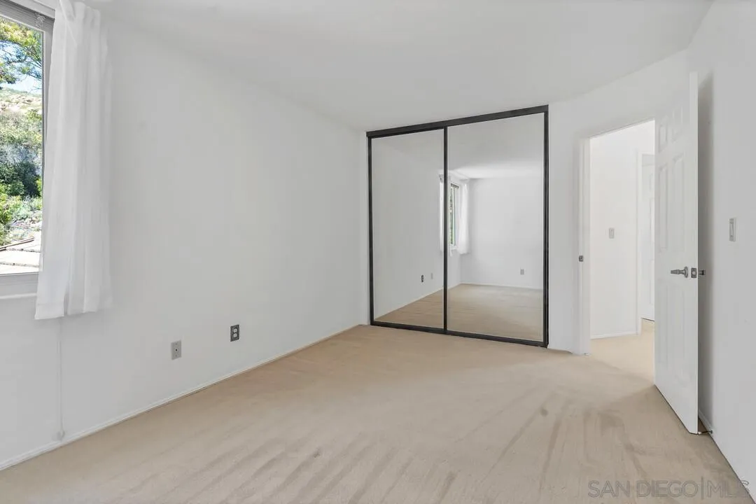 7967 Wing Span Drive San Diego, CA 92119 - Photo 32 of 45 a view of an empty room with a window
