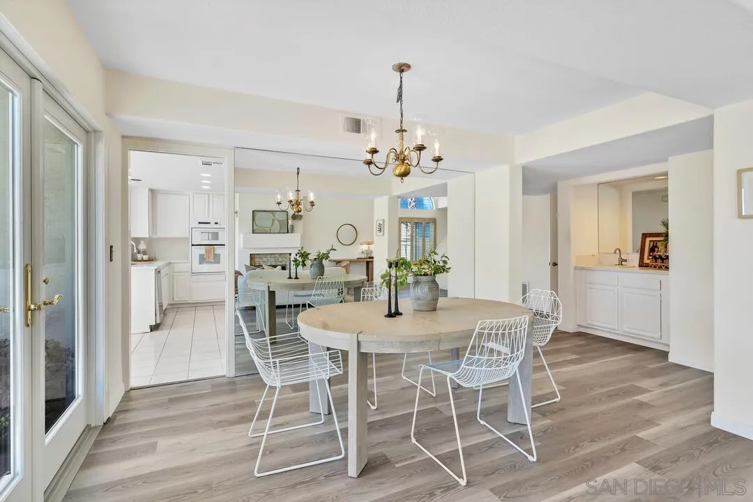 7967 Wing Span Drive San Diego, CA 92119 - Photo 7 of 45 a view of a dining room with furniture and wooden floor