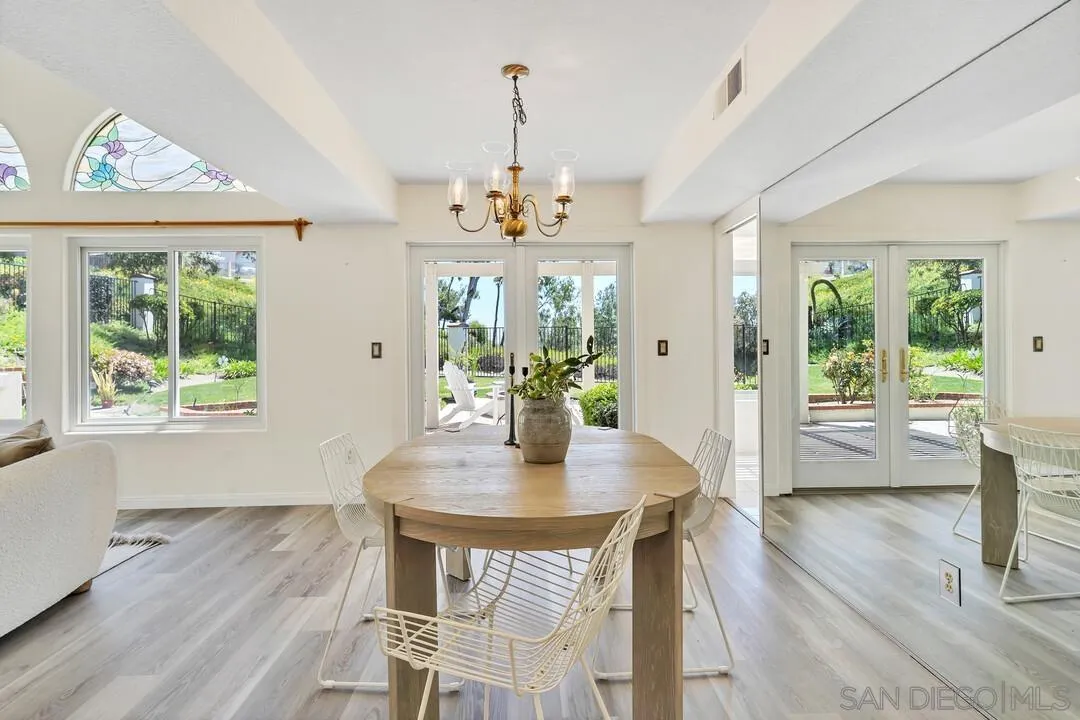 7967 Wing Span Drive San Diego, CA 92119 - Photo 8 of 45 a view of a dining room with furniture window and wooden floor
