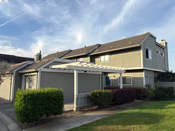 front view of a house with a garden