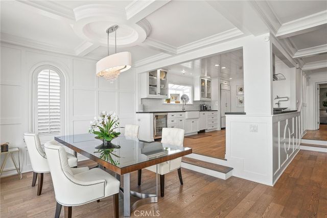 a large white kitchen with stainless steel appliances