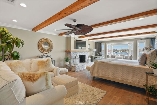 a bathroom with a double vanity sink large mirror and a bathtub
