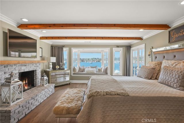 a bedroom with a bed and a television