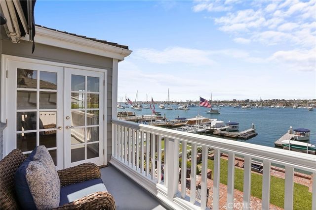a spacious bedroom with a bed and a flat screen tv