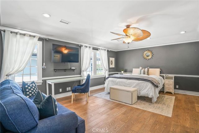 a view of a lake with boats and trees in the background