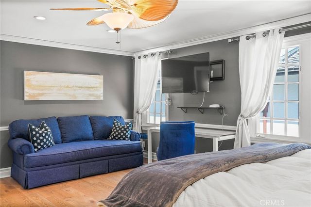 a view of a roof deck with couches and city view