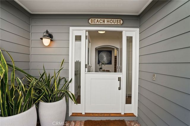 a living room with fireplace furniture and a wooden floor