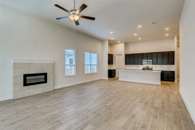 a view of kitchen with cabinets and wooden floor