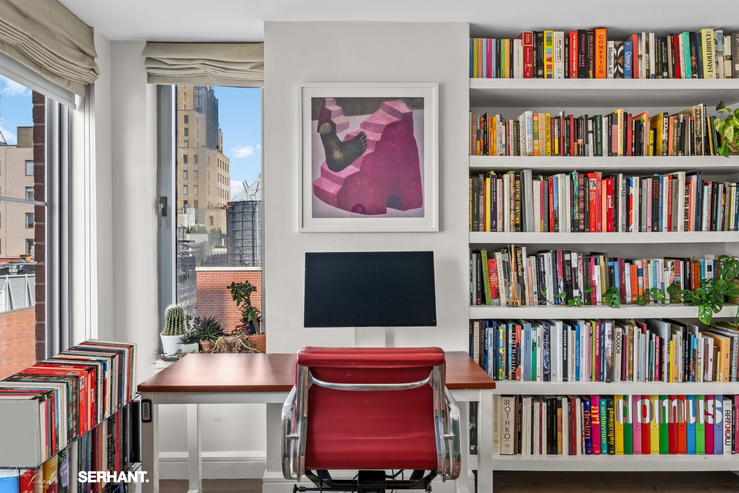 270 West 17th Street, Unit 12BC Manhattan, NY 10011 - Photo 17 of 23 a living room with bookshelf and a book shelf