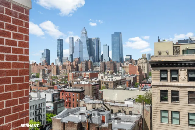 a view of a city with tall buildings