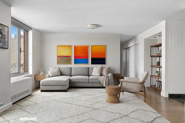 a living room with furniture and a window