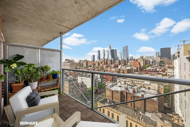 a view of a balcony with furniture