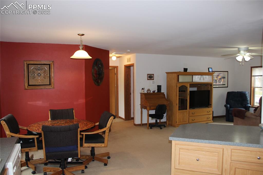 749 B 9th Street Calhan, CO 80808 - Photo 14 of 46 a workspace with furniture and a lamp