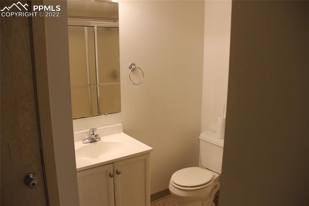 749 B 9th Street Calhan, CO 80808 - Photo 33 of 46 a bathroom with a sink a toilet and shower