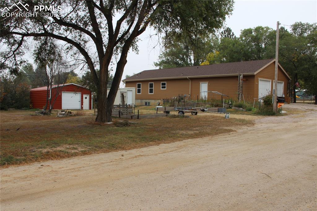 749 B 9th Street Calhan, CO 80808 - Photo 44 of 46 a front view of a house with a yard