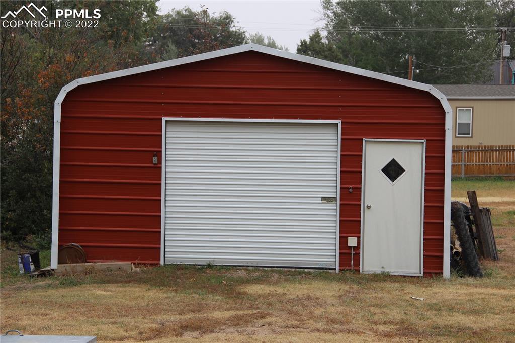 749 B 9th Street Calhan, CO 80808 - Photo 45 of 46 a front view of a house with a garage
