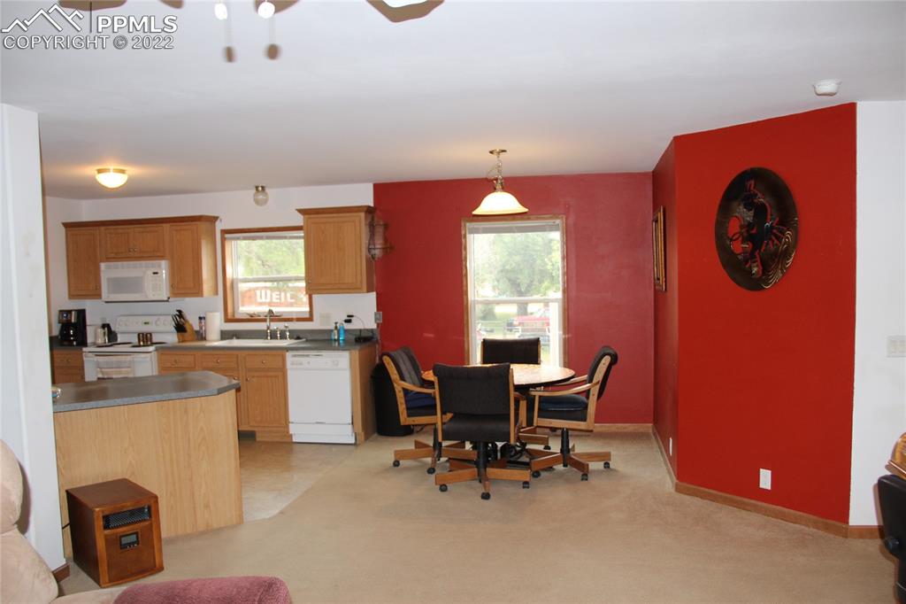 749 B 9th Street Calhan, CO 80808 - Photo 7 of 46 a view of a dining room with furniture and window