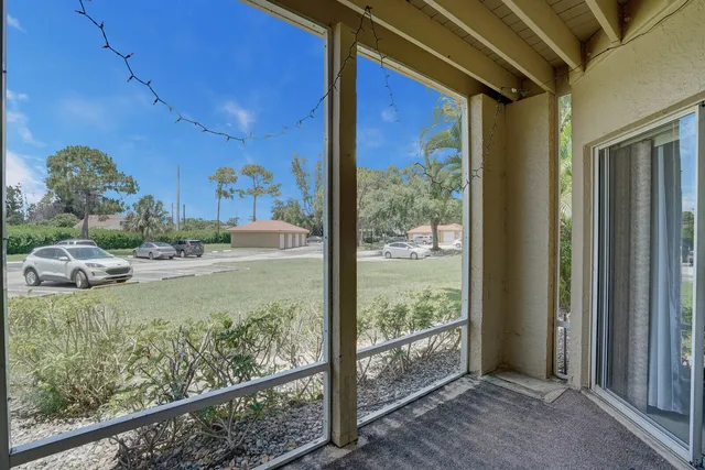 a view of small yard with wooden floor