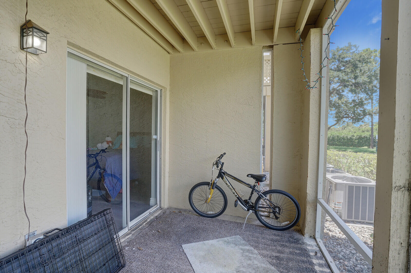 4855 Via Palm Lakes, Unit 902 West Palm Beach, FL 33417 - Photo 19 of 24 a view of small yard with wooden floor