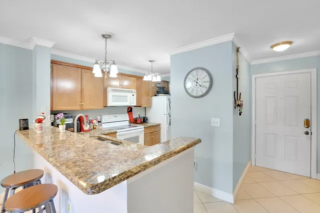 a very nice looking dining room with a table and chairs