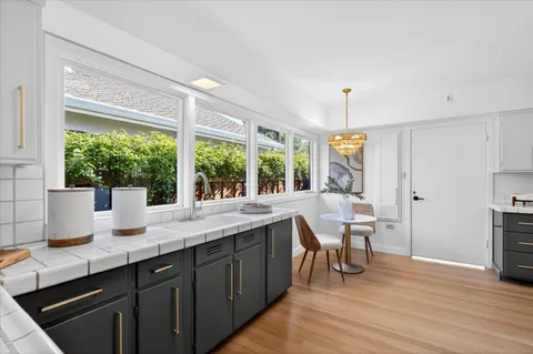 a kitchen with a sink and wooden cabinets