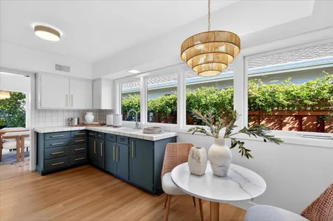 a kitchen with a sink and a stove