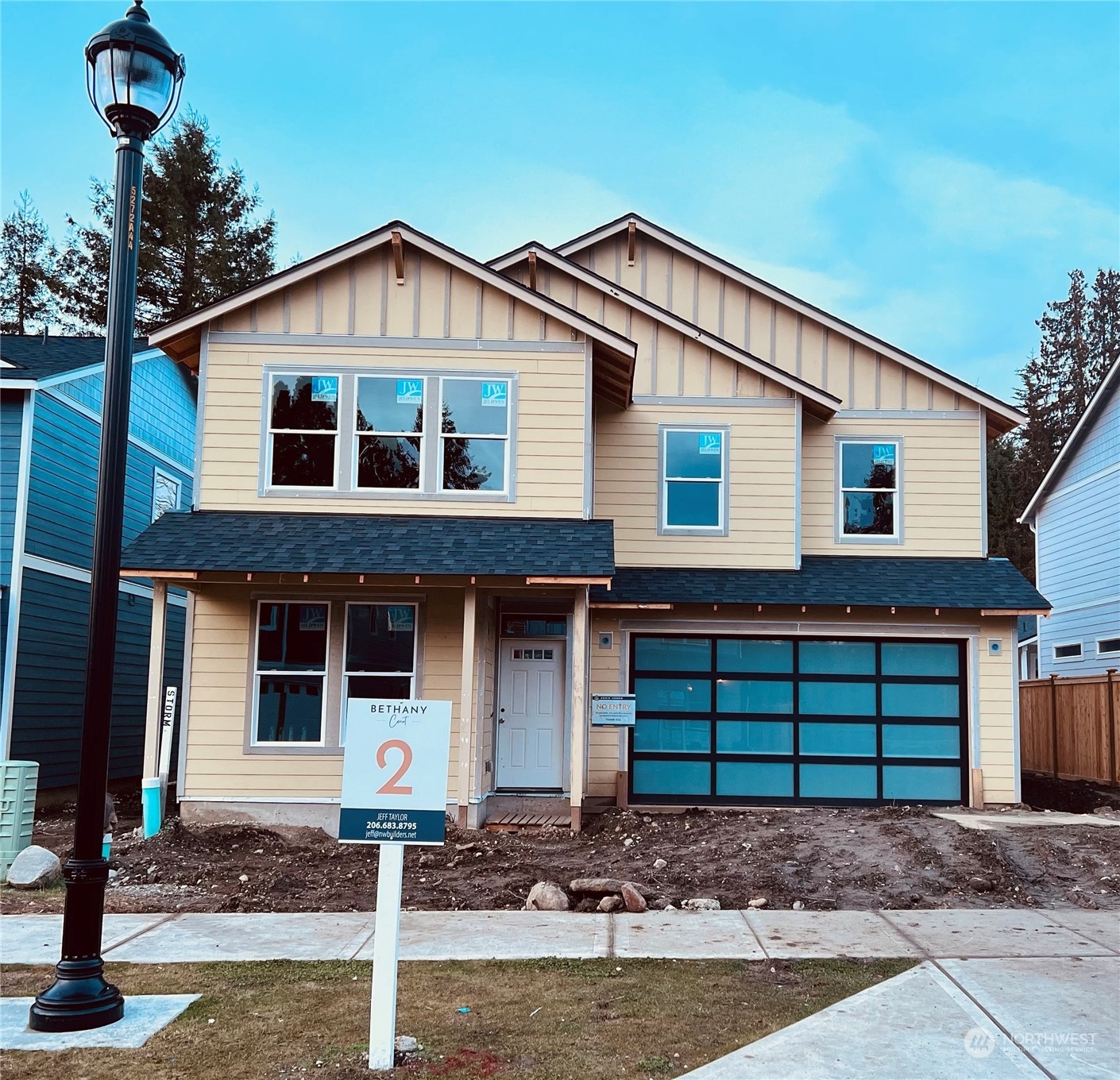 10980 Southeast 165th Street Renton, WA 98055 - Photo 3 of 16 a front view of a house with a yard and garage