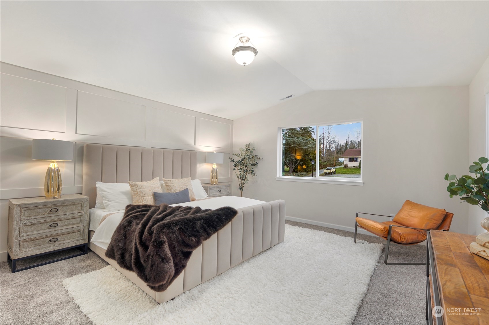 10980 Southeast 165th Street Renton, WA 98055 - Photo 9 of 16 a spacious bedroom with a bed and a couch