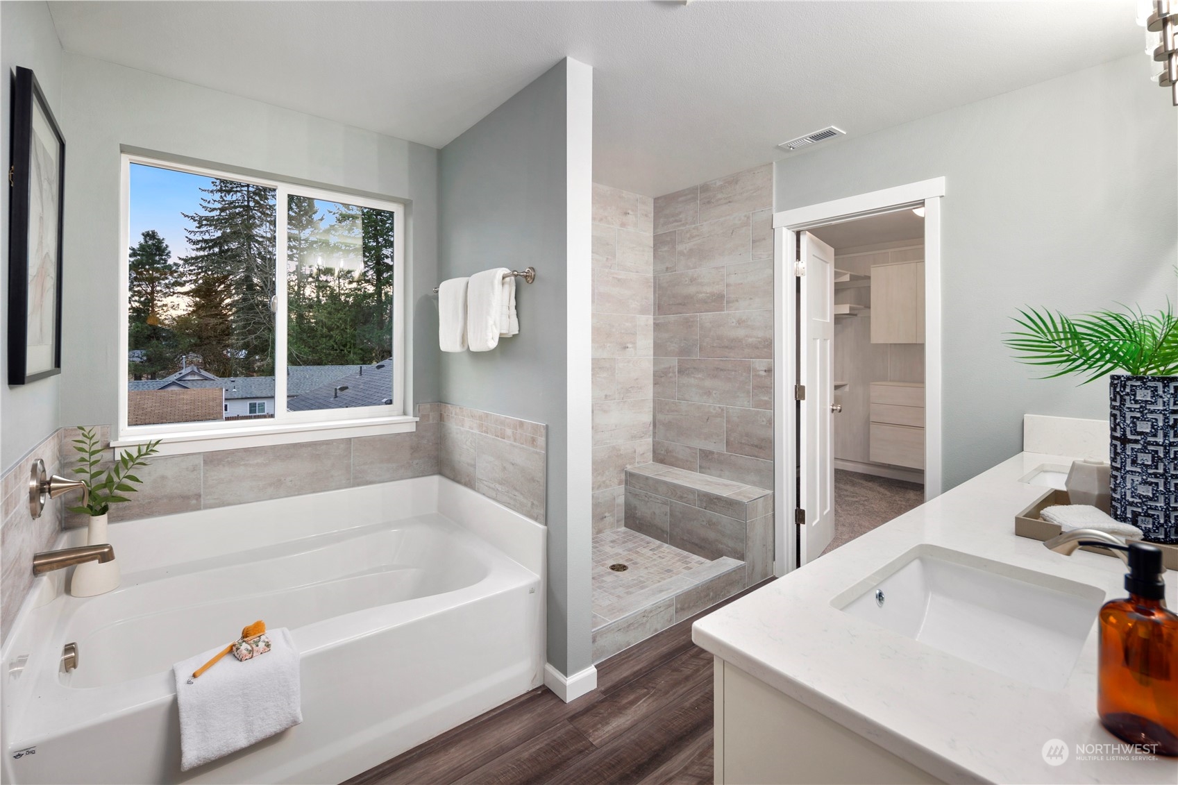 10980 Southeast 165th Street Renton, WA 98055 - Photo 10 of 16 a white bath tub sitting next to a white sink