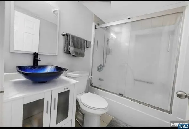 a bathroom with a toilet a sink and bathtub