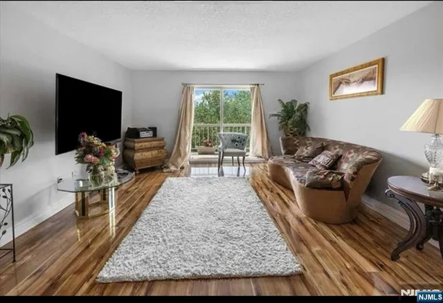 a living room with furniture fireplace and a flat screen tv