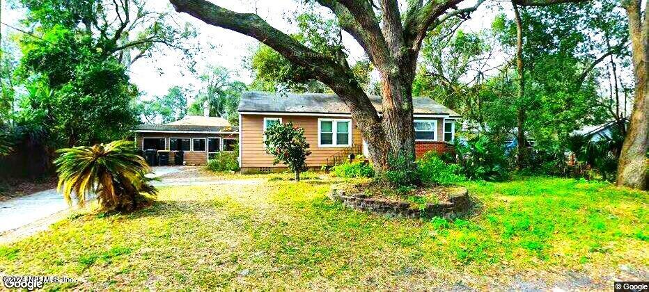 1822 Lilly Road East Jacksonville, FL 32207 - Photo 1 of 22 front view of house with a yard