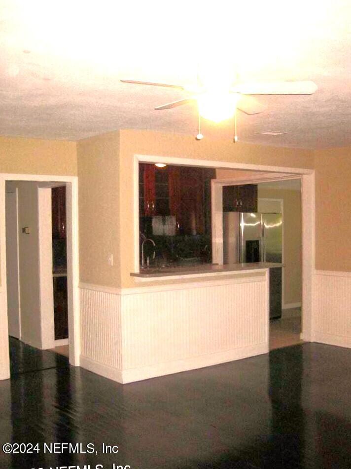 1822 Lilly Road East Jacksonville, FL 32207 - Photo 10 of 22 a view of a living room and a kitchen with furniture