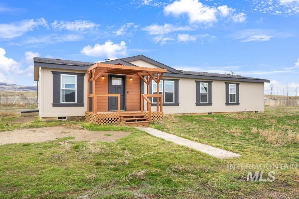 9446 Wright Road Melba, ID 83641 - Photo 1 of 1 Ranch-style home with crawl space, a front yard, and a porch