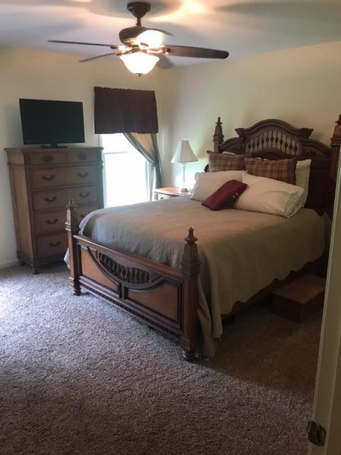5070 Joe Peay Road Spring Hill, TN 37174 - Photo 3 of 25 a bedroom with a bed and a flat screen tv