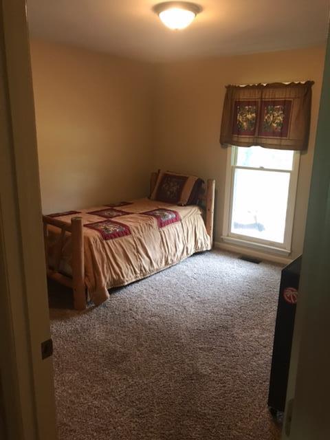 5070 Joe Peay Road Spring Hill, TN 37174 - Photo 5 of 25 a bedroom with a bed and a window