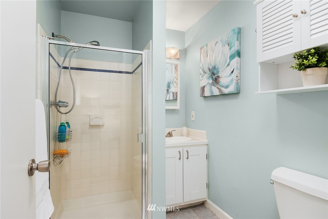 21814 6th Avenue West Bothell, WA 98021 - Photo 14 of 23 a bathroom with a shower and a toilet