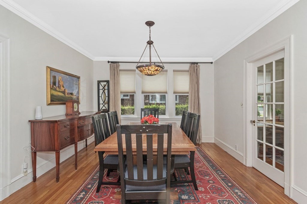 50 Crosby Road, Unit 1 Chestnut Hill, MA 02467 - Photo 6 of 27 a view of a dining room with furniture window and wooden floor