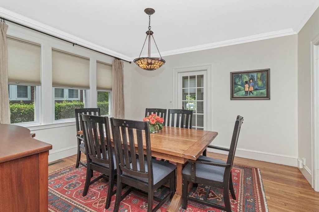 50 Crosby Road, Unit 1 Chestnut Hill, MA 02467 - Photo 8 of 27 a view of a dining room with furniture window and wooden floor