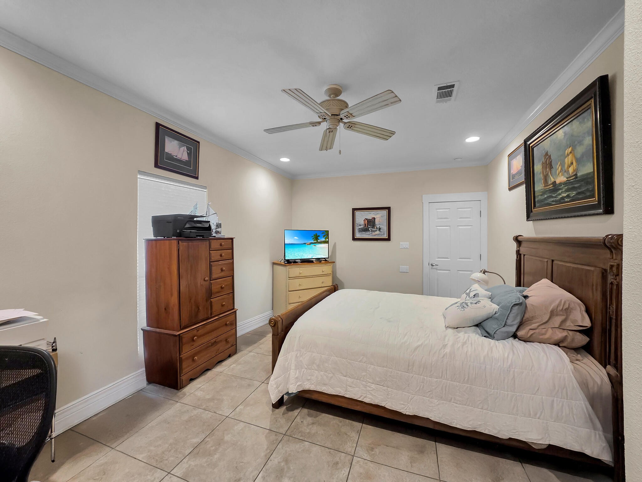 2383 Sandpiper Crystal Beach, TX 77650 - Photo 13 of 48 a bedroom with a large bed a flat tv screen and dresser