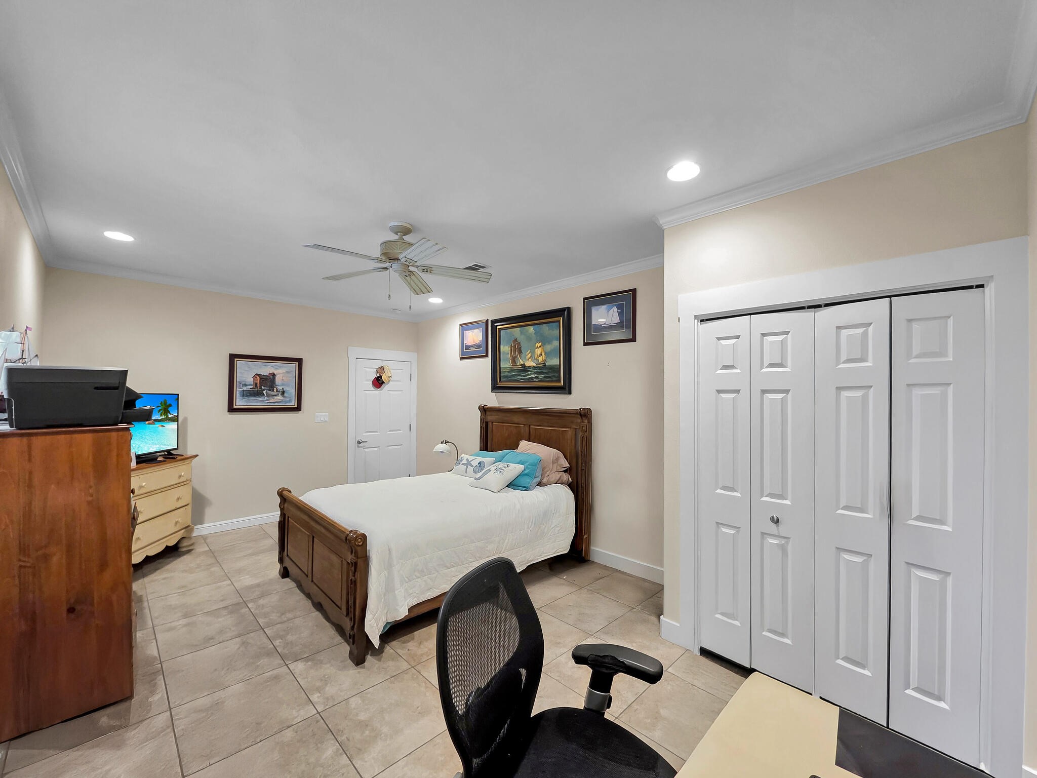 2383 Sandpiper Crystal Beach, TX 77650 - Photo 14 of 48 a bedroom with a bed and a chandelier
