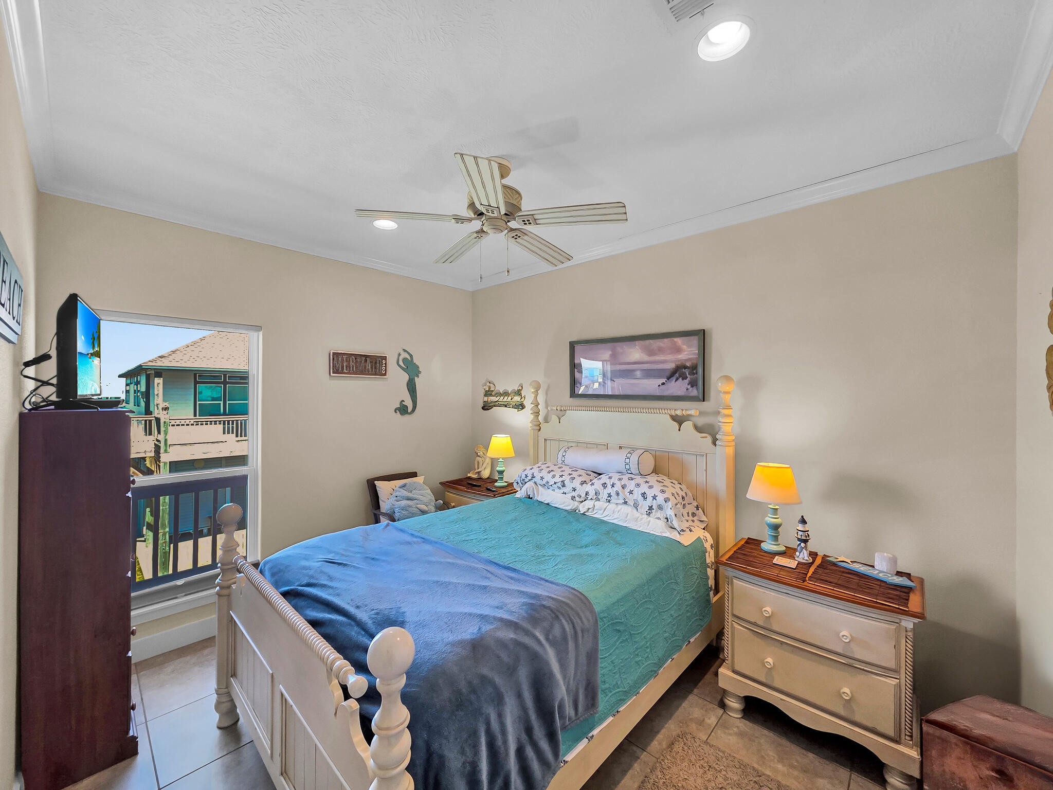2383 Sandpiper Crystal Beach, TX 77650 - Photo 15 of 48 a bedroom with a bed and a chandelier