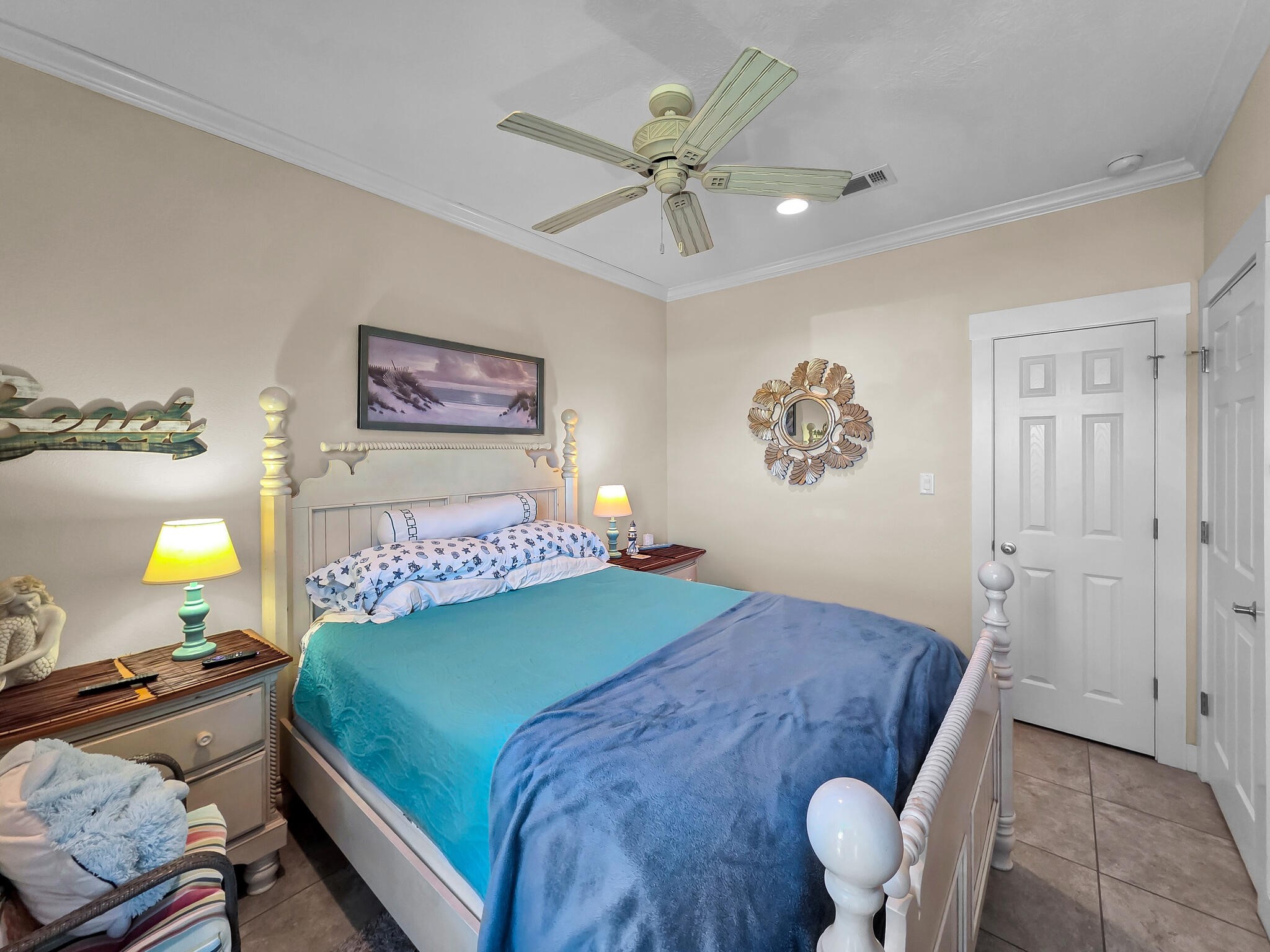 2383 Sandpiper Crystal Beach, TX 77650 - Photo 16 of 48 a bedroom with a bed and painting on the wall
