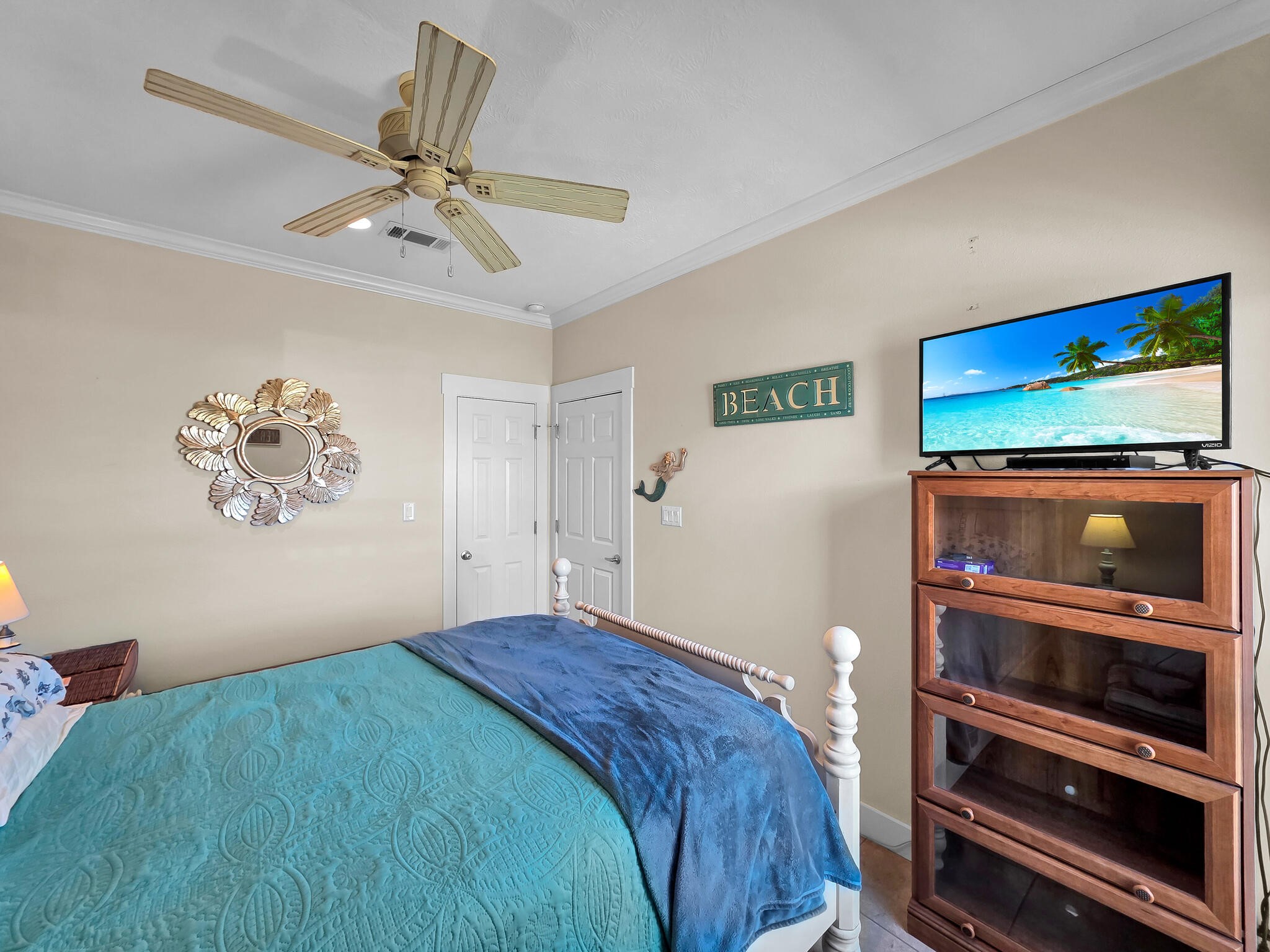 2383 Sandpiper Crystal Beach, TX 77650 - Photo 17 of 48 a bedroom with a bed and a painting on the wall